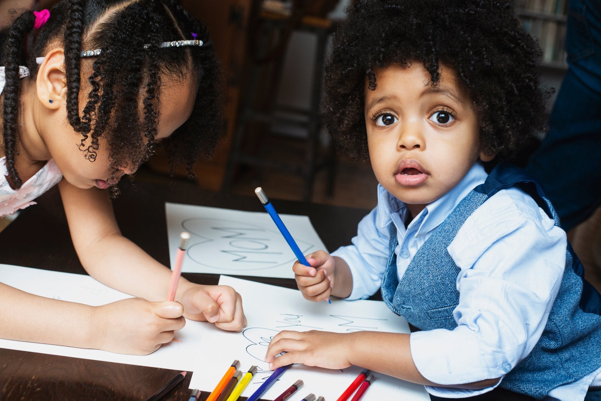 Eager Kinder™ - kids-coloring-at-table using worksheets